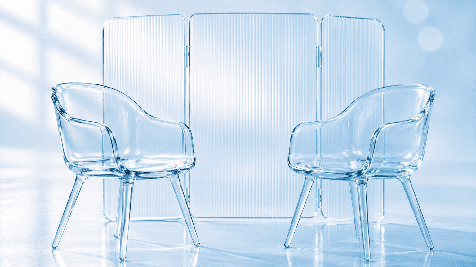 Two empty glass chairs facing each other behind a privacy screen, illustrating a first counselling session and what stays confidential